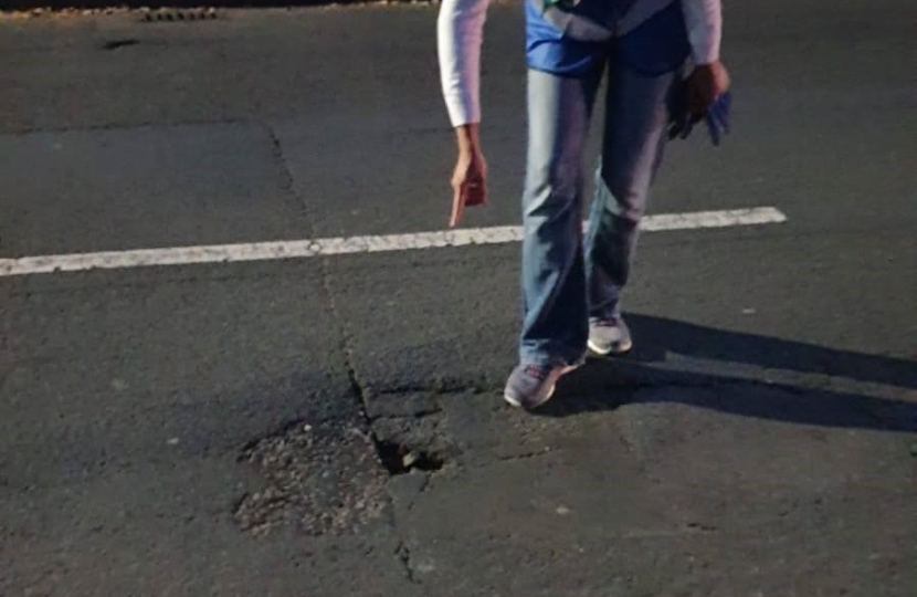 Noshaba local action team member on Friday pothole patrol